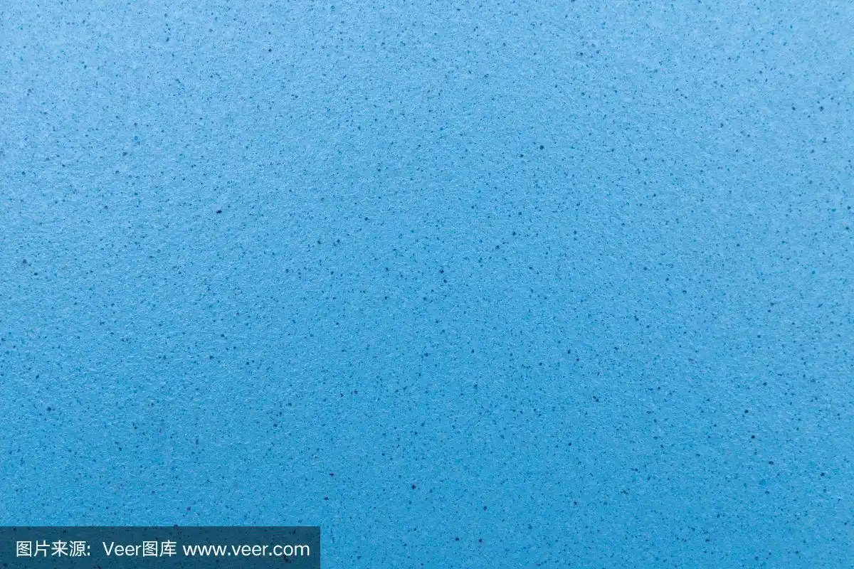 一个蓝色瓷砖的特写与深蓝色的点图案