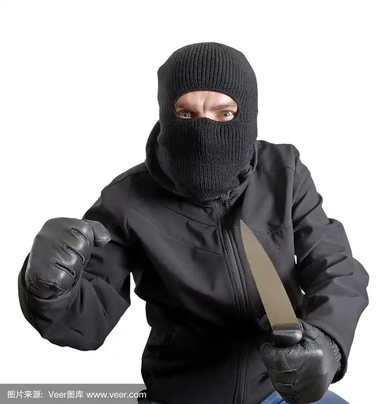 蒙面罪犯拿着刀,孤立上白