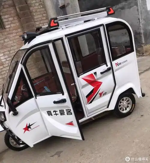 自从有了这辆电动三轮车再也不用为刮风下雨天接送孩子而发愁了