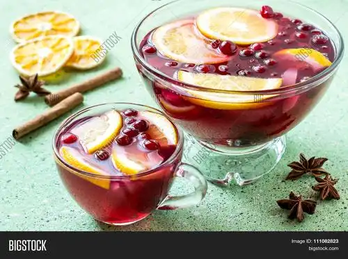 punch - celebratory drink of wine spices and fruits in a bowl