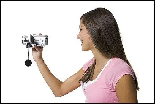 侧面,女青年,拿着,摄像机