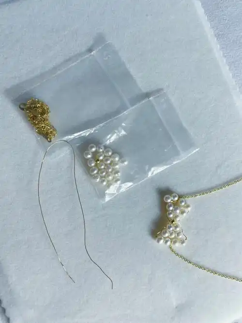 好物分享手工编织珍珠蝴蝶结吊坠小众款