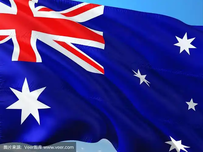 在深蓝色天空中迎风飘扬的澳大利亚国旗.高质量的织物.