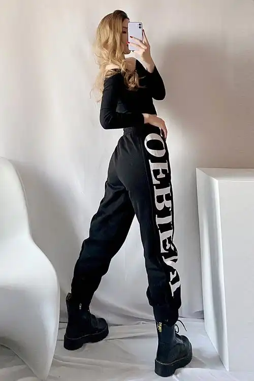 马丁靴裤子束脚裤女2021春秋新款百搭显瘦字母黑色休闲裤ins潮牌