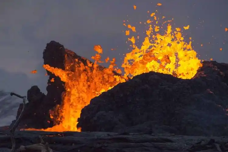 volcanic ash swamps hawaii school, turning tennis court gray