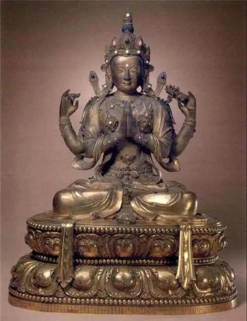 (康熙二十五年御制铜鎏金四臂观音像北京故宫博物院藏)