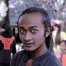 从中国佤族的体貌和历史提出黄白人种是古棕种人的分化