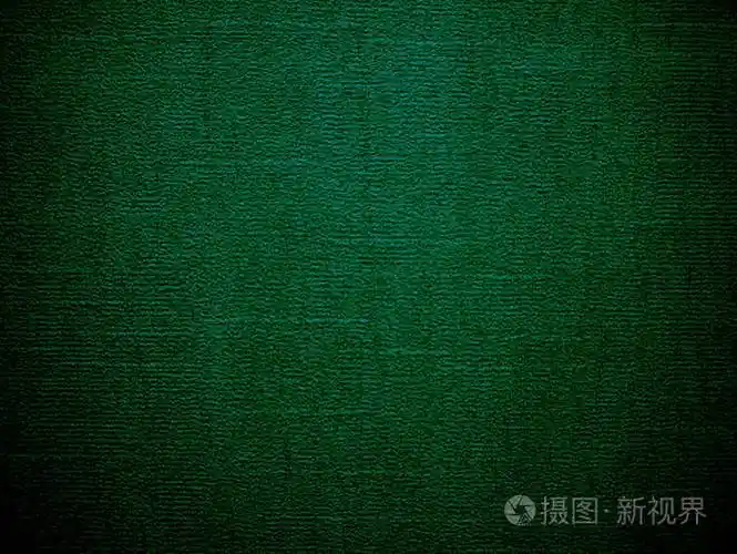 深绿色纹理背景.有着深色的边缘.用于刻字和复印空间