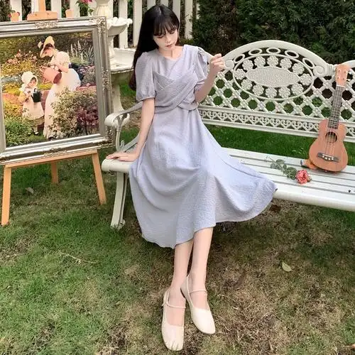 女装设计感交叉露背系带蝴蝶结连衣裙夏气质网红遮肚显瘦长裙大码