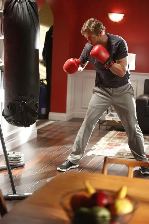 harry accepts a punch to the face and some kicks to the gut from