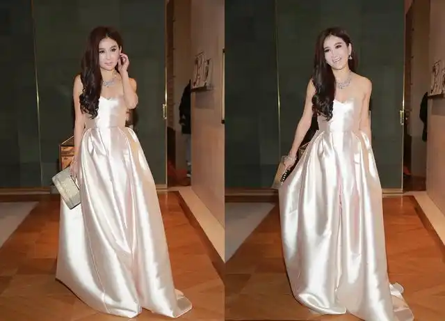 看不出温碧霞50多岁了,穿缎面裙风情迷人,就是发型有点拉低穿搭