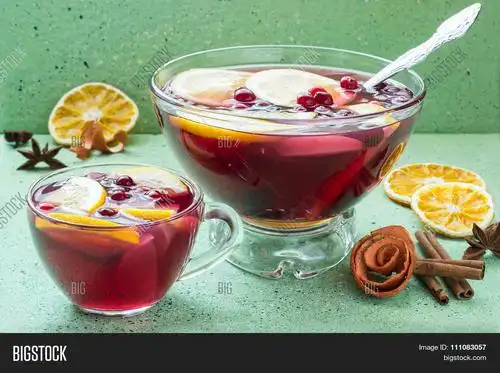 punch - celebratory drink of wine spices and fruits in a bowl