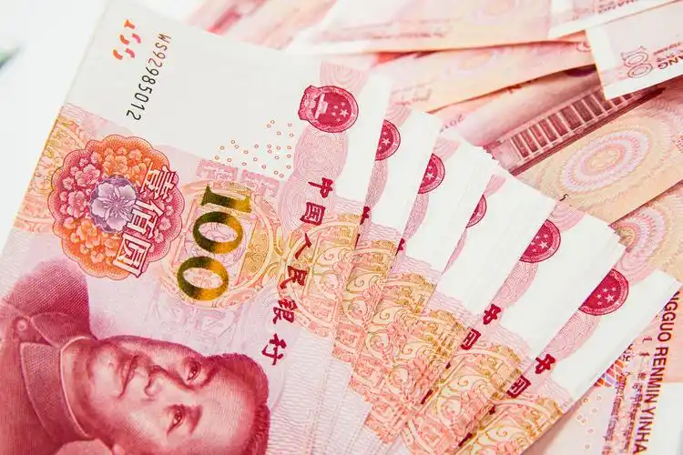 百元人民币堆放背景图片